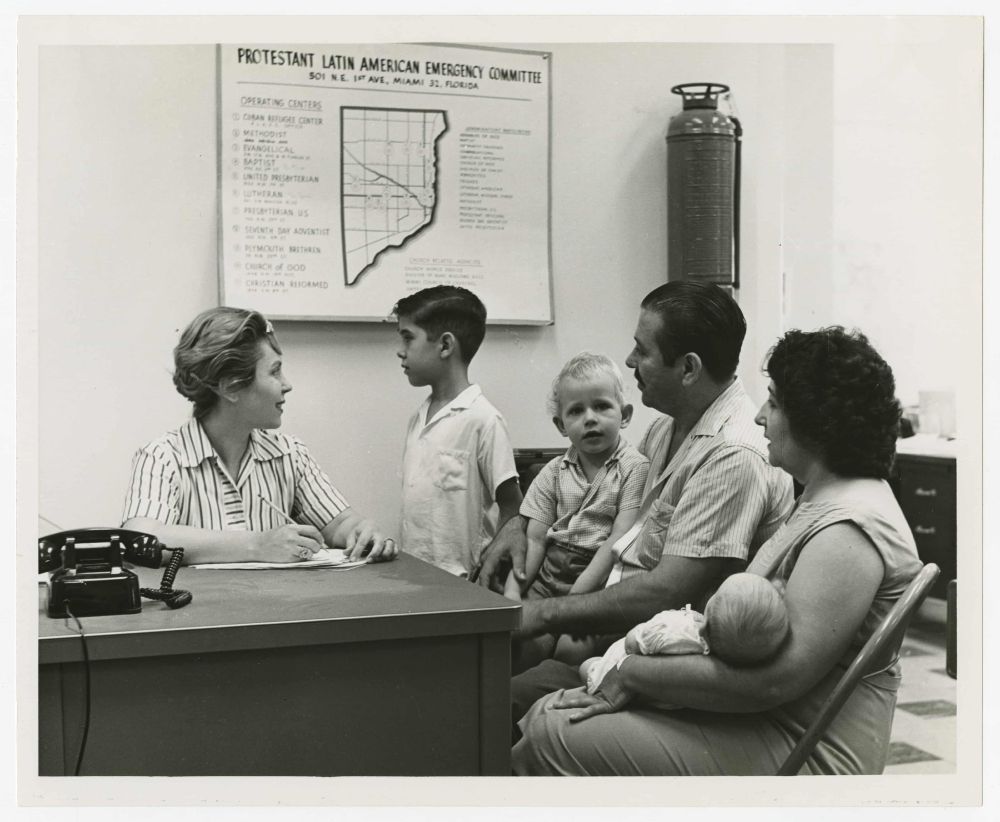 A family is interviewed at the Cuban refugee centre circa 1965.
Photograph: Cuban Heritage Collection/University of Miami Libraries

The photograph appeared in the Guardian on August 10, 2025 as part of an article about the reopening of the Freedom Tower in downtown Miami that served as a refugee center for Cubans in the 1960s