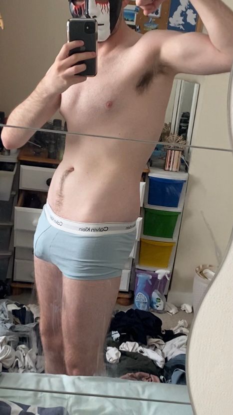 Hot sexy lad in boxers tensing 