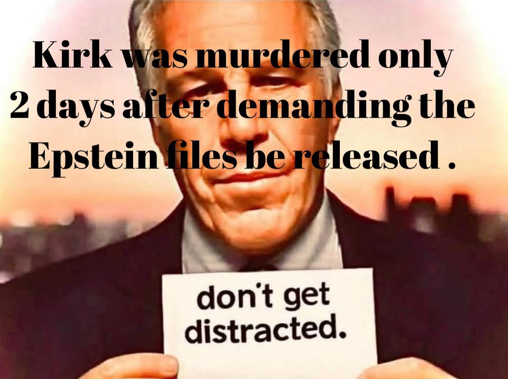 Photo of Epstein, holding a white card, don't get distracted