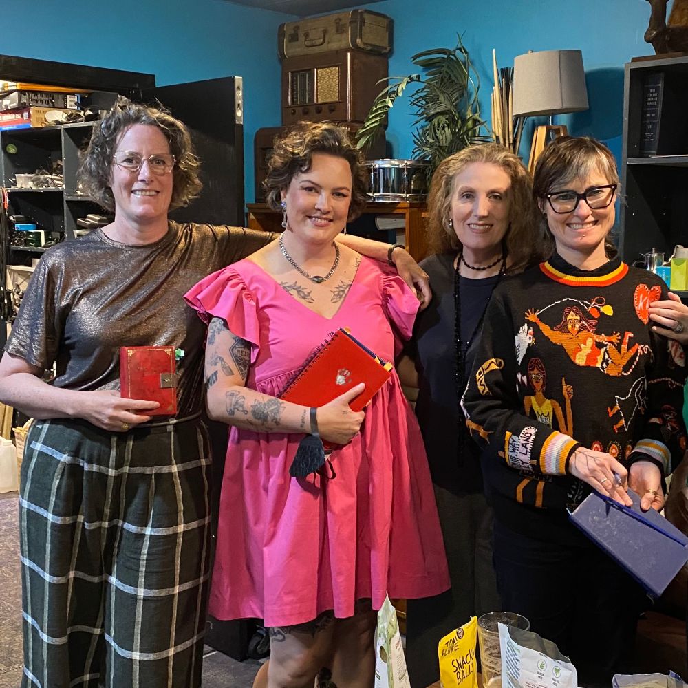 Kate Camp, Emily Writes, Catherine Chidgey and Fiona Kelly McGregor backstage at Meow, each holding their diaries