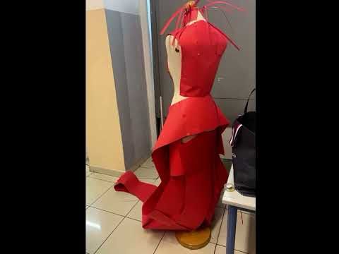 Making a dress entirely by red A4 paper