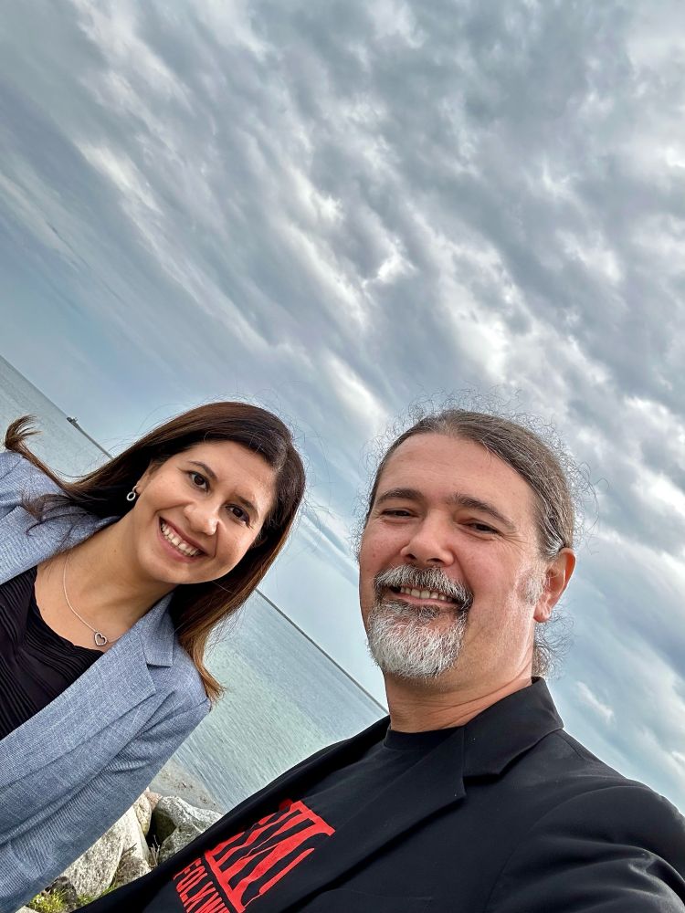 Two people looking at a camera