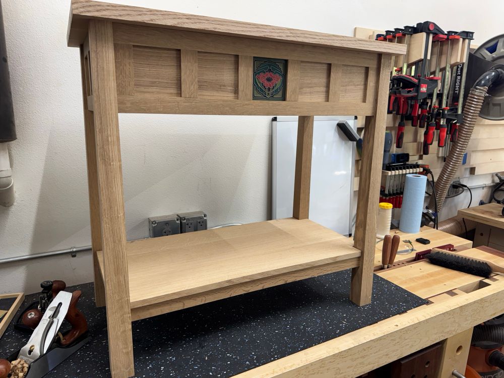Console table made out of quartersawn white oak with a clay accent tile on the face. Dry assembly.