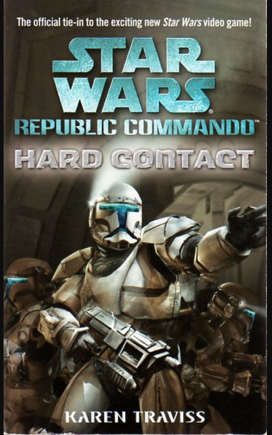 Grey background, likely the exterior of a spaceship. A figure dressed in the white t-masked armor of a Star Wars Republic Commando is centered in the image, pointing off into the distance with their blaster aimed toward the ground but ready to bring up at a moment’s notice. Two other similarly armored clone troopers are in the background. Trivia: First Star Wars novelization I’d read since “Empire Strikes Back” back in 1980-something.
