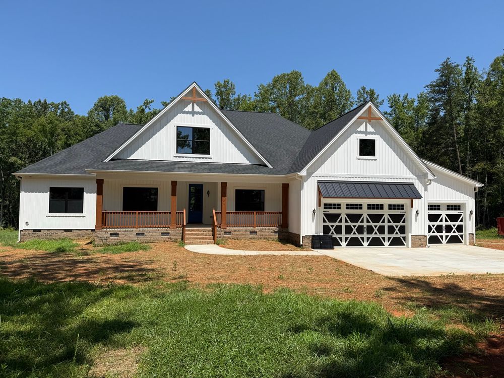 A newly-built white farmhouse-style home