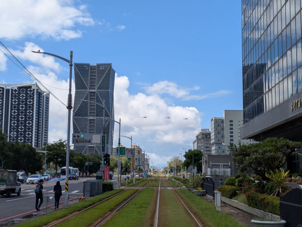 Three helicopters fly over the Software Technology Park in Kaohsiung, Taiwan on their way to the coast guard military exercise over the weekend