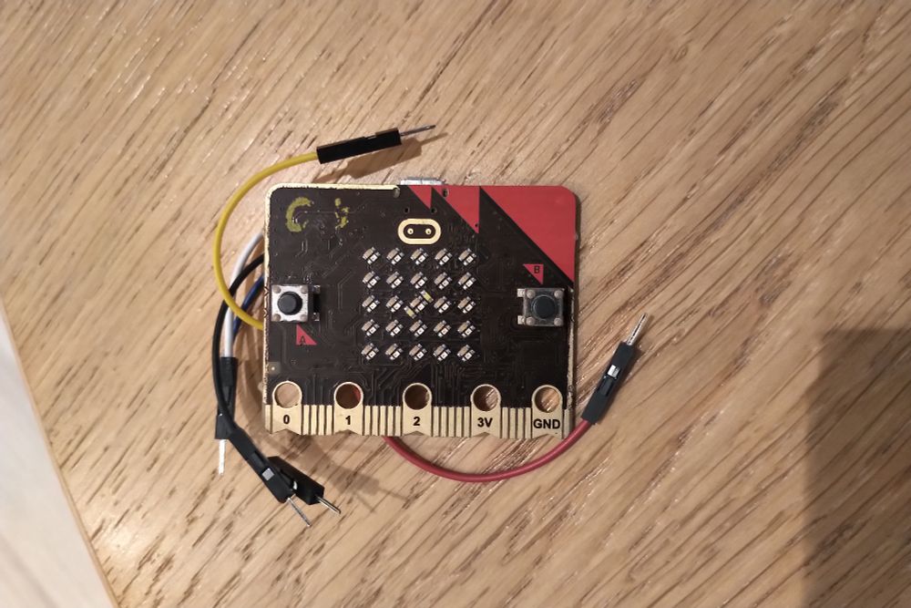 a prototype micro:bit V2 with flywires connected