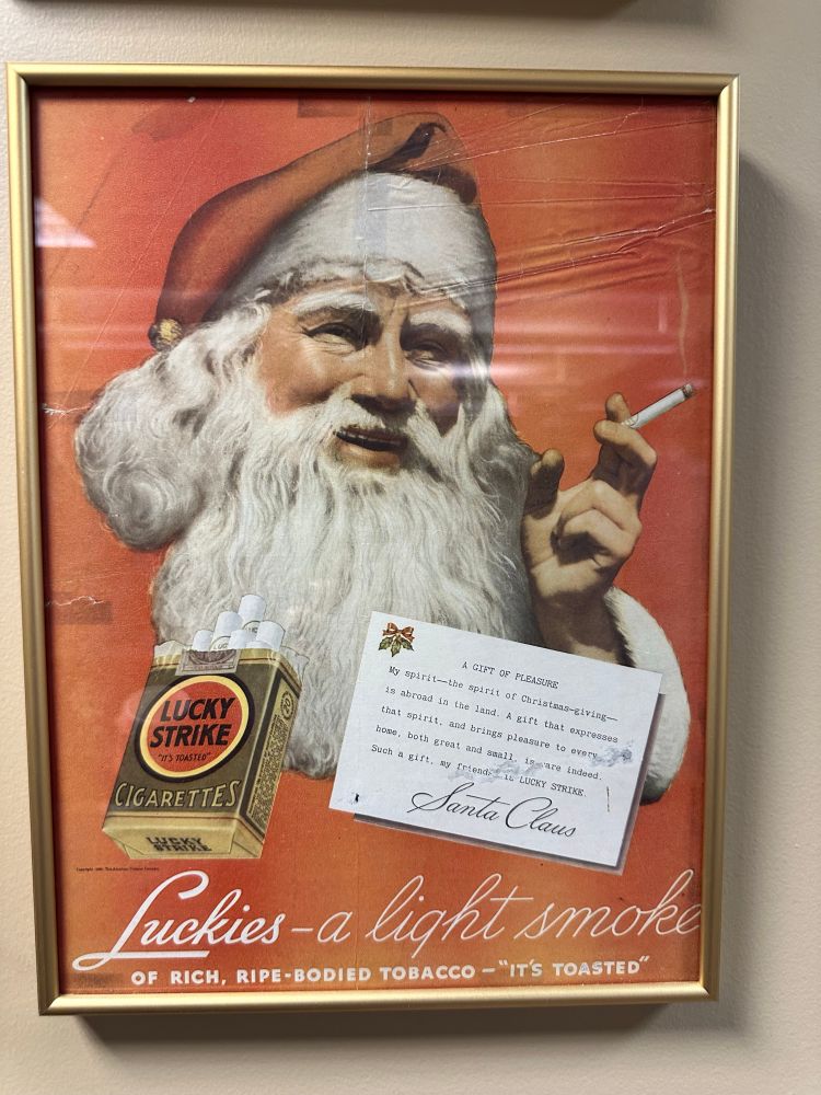 Santa smoking a lucky strike cigarette