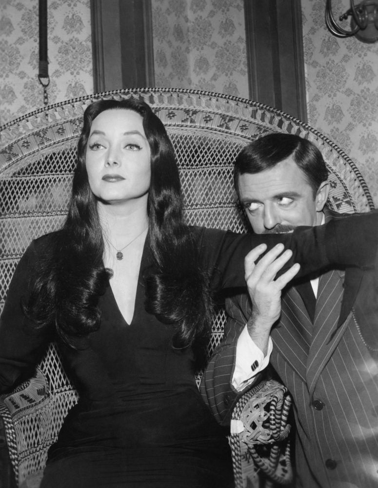 Carolyn Jones and John Astin as Morticia and Gomez Addams