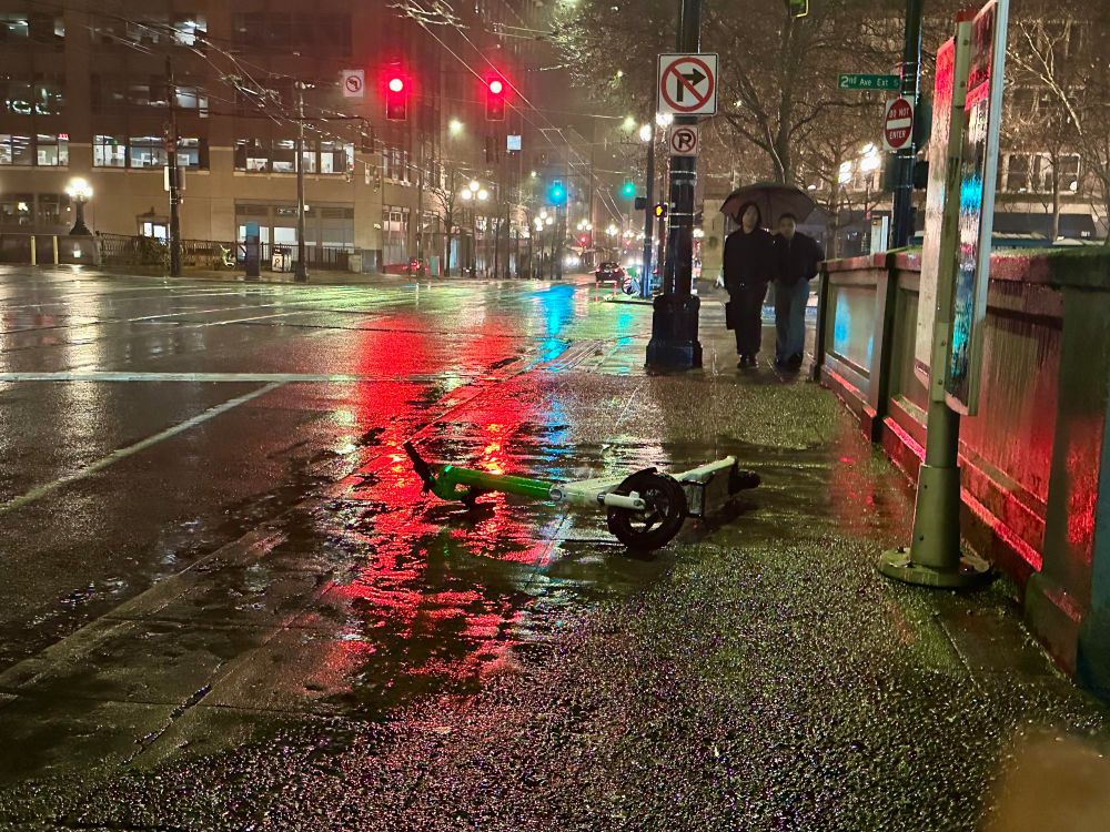 electric scooter on "sharing" network blocking a sidewalk