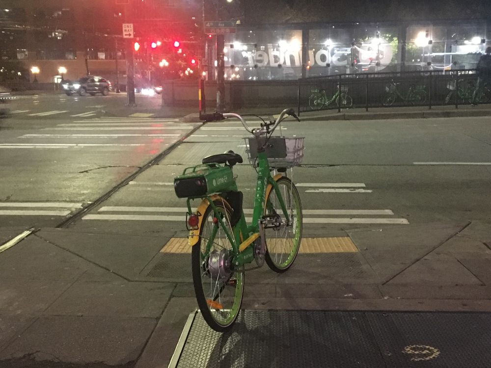 electric bike on "sharing" network blocking a sidewalk ramp