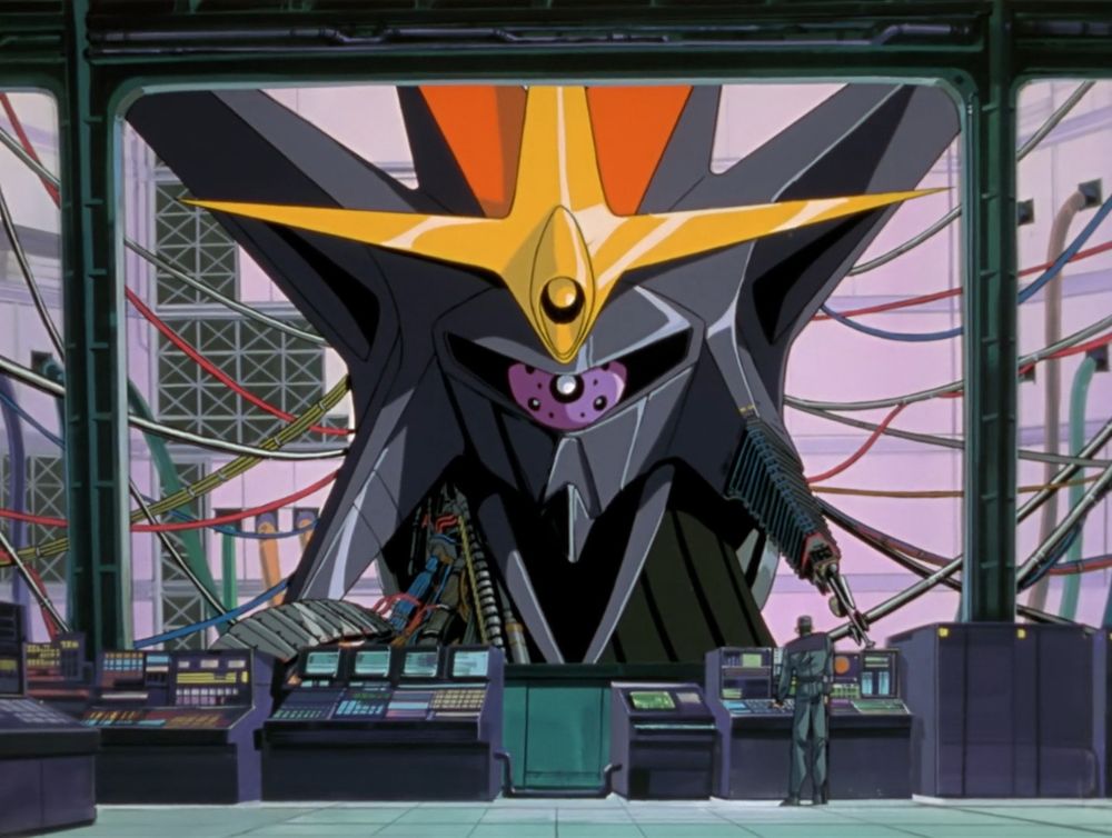 Giant spiky metal head seen through a large spaceship window with controls and a man at the bottom