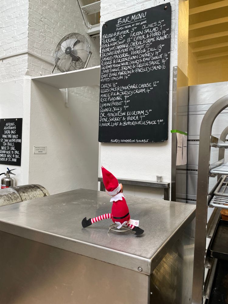 The menu, written on a chalkboard, at St John’s restaurant. A Christmas elf looks on.