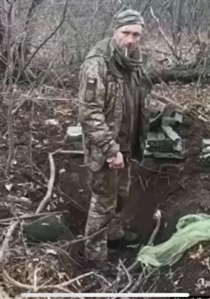 On 6 March 2023, a graphic 12-second video was published[5] showing an unidentified soldier in camouflage Ukrainian uniform, unarmed, standing in a shallow trench in a winter wood, calmly puffing a cigarette.[6] As the man is heard saying "Slava Ukraini" ("Glory to Ukraine"), salvos of automatic weapons from multiple sides are heard and seen shooting the man, who collapses.[3][6][7] Voices in the Russian language are heard saying "Die, bitch".[3][7] Before the murder, he was allegedly forced to dig his own grave, in the video he is in a hole, and there is a shovel behind him.[8]