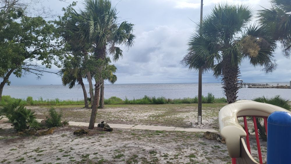 Looking over St. Joseph's Bay from behind the jetty edge on a park toy. 