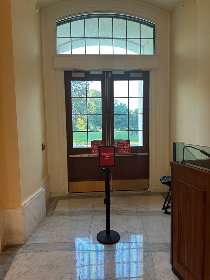 Door which indicates a fire alarm would sound and then the door would unlock, allegedly used by Congress member Jamaal Bowman