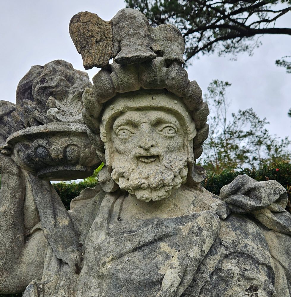 A statue of a Greek God, with uncannily wide-set eyes, looking generally befuddled.