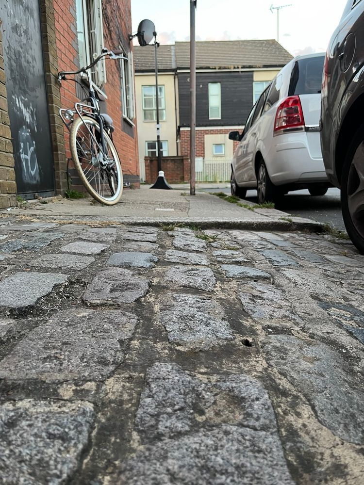 On the far side of the entrance way, the dropped kerb is not flush with the carriageway