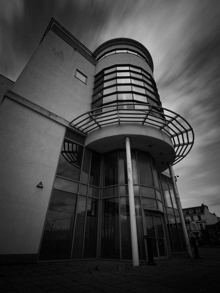 Long exposure of an closed down office block in Southport in black and white