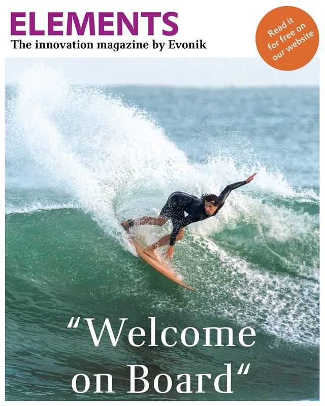 A surfer rides a wave and perfomes a 180 degrees turnaround.