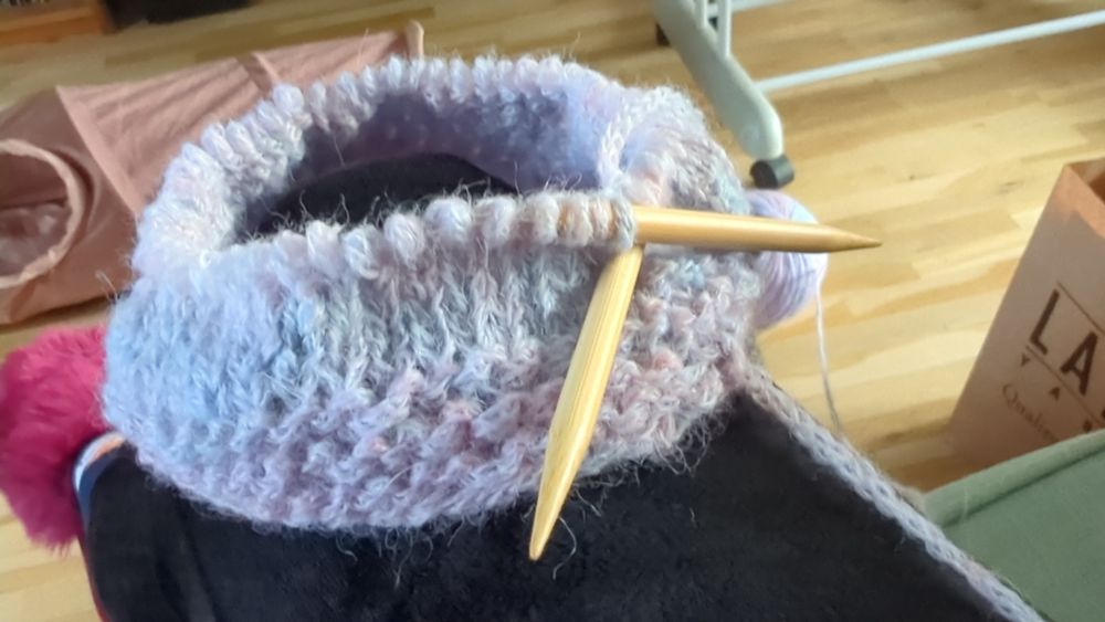 The beginning of the neck piece of the poncho