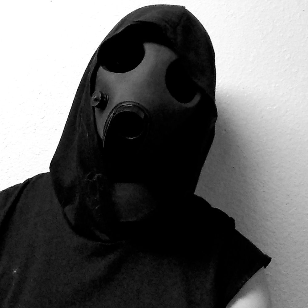 closeup on the hooded gas mask STARING INTO YOUR SOUL