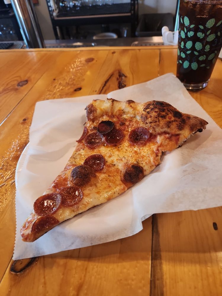 A beautiful slice of New York style pepperoni pizza.  