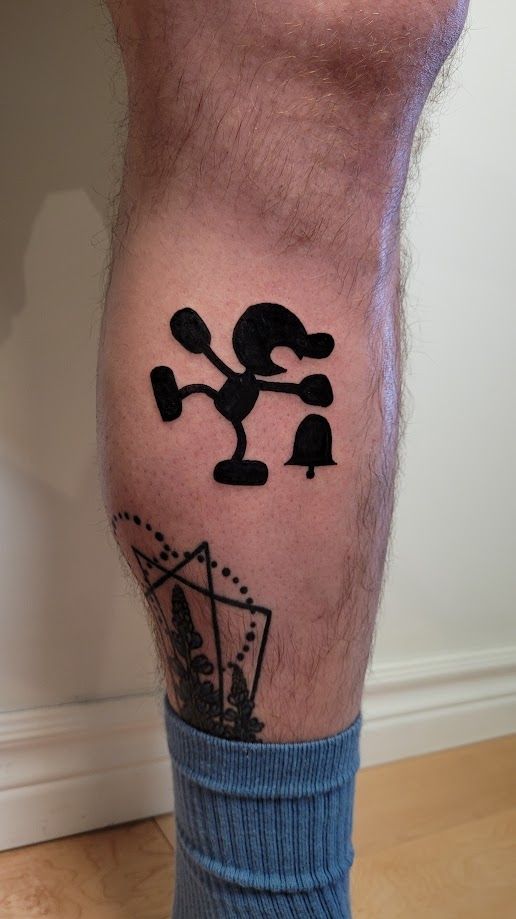 tattoo of mr.game and watch on someone's leg by spoopy