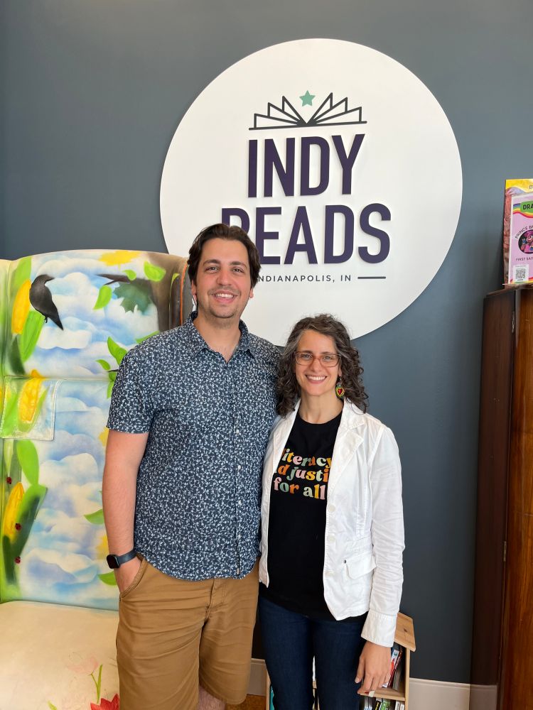 A photo of Michael Zarick and Ruba Marshood in Indy Reads near the big reading chair.