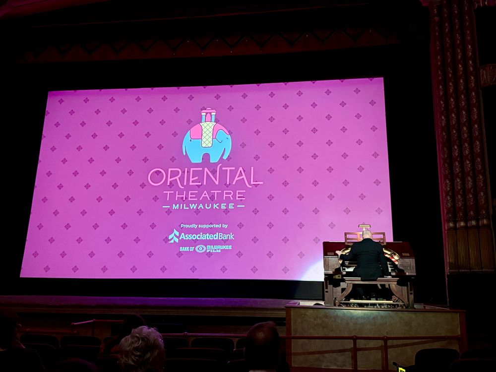 Intro screen for Milwaukee’s Oriental Theater with a gentlemen playing the Wurlitzer organ, just before he and the instrument descend into the pit