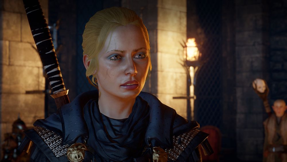 Screenshot of Claire Trevelyan a honey blonde mage with pale skin and bright blue eyeshadow.