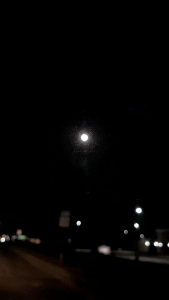 Blurry photo of the worm moon taken with Snapchat while in the car.