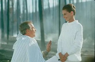 Richard Dreyfuss having his haircut in a burned down forest by Audrey Hepburn. 