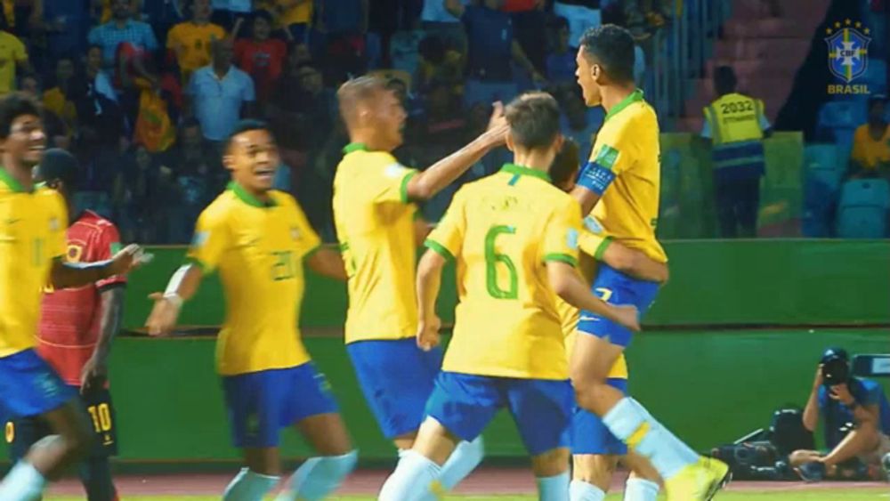 a group of soccer players are celebrating a goal and one of them has the number 6 on his back