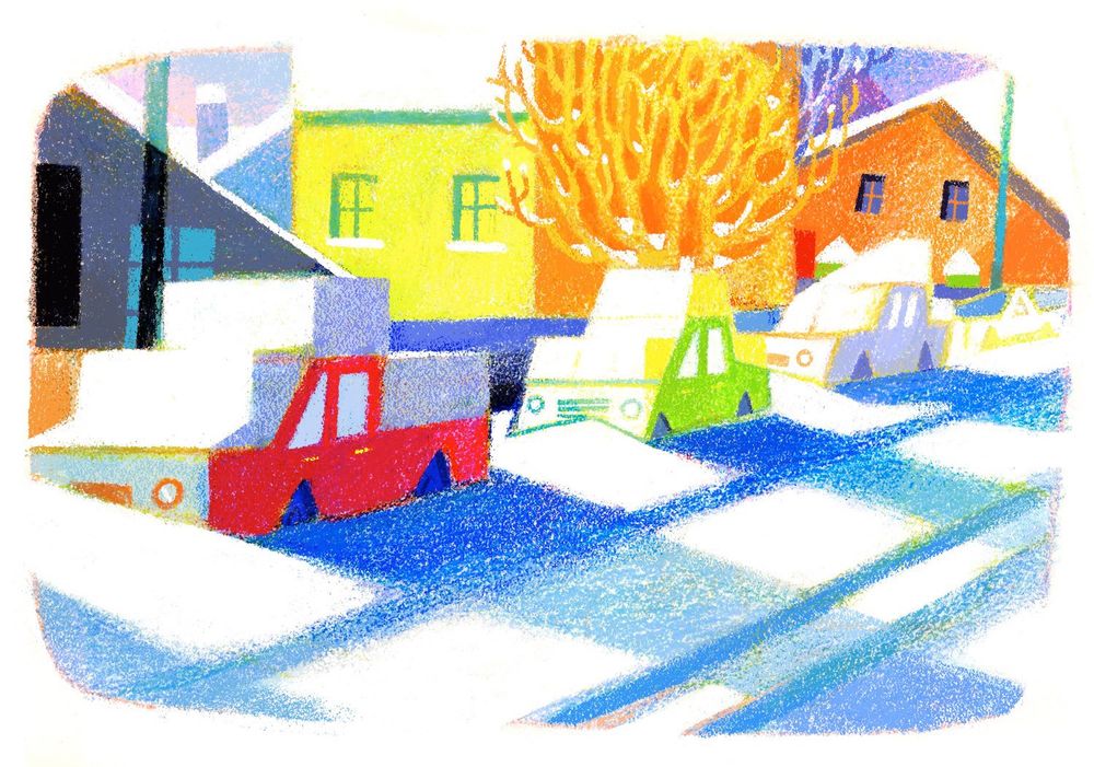 A winter sunrise casts shadows across a snowy street 