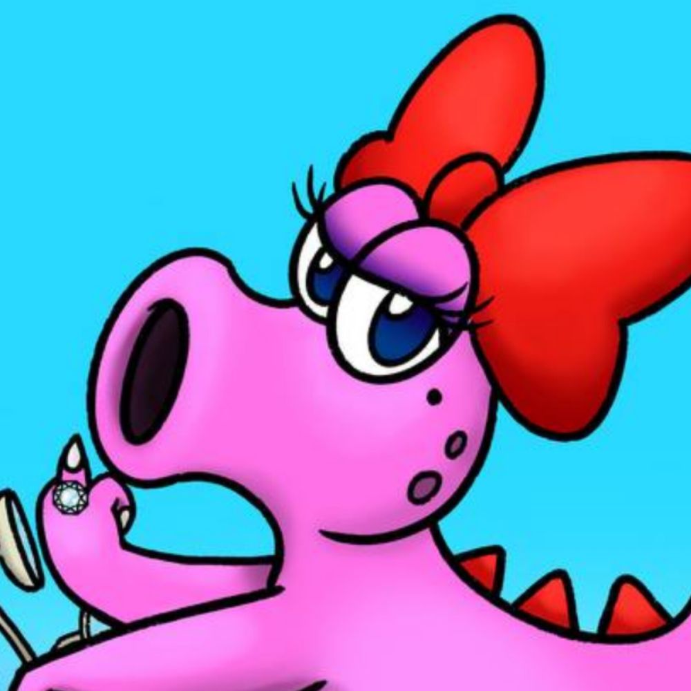 Detalle de la cara de Birdo con cara de chula mirando a cámara y sacando el dedo con un anillo de diamante.