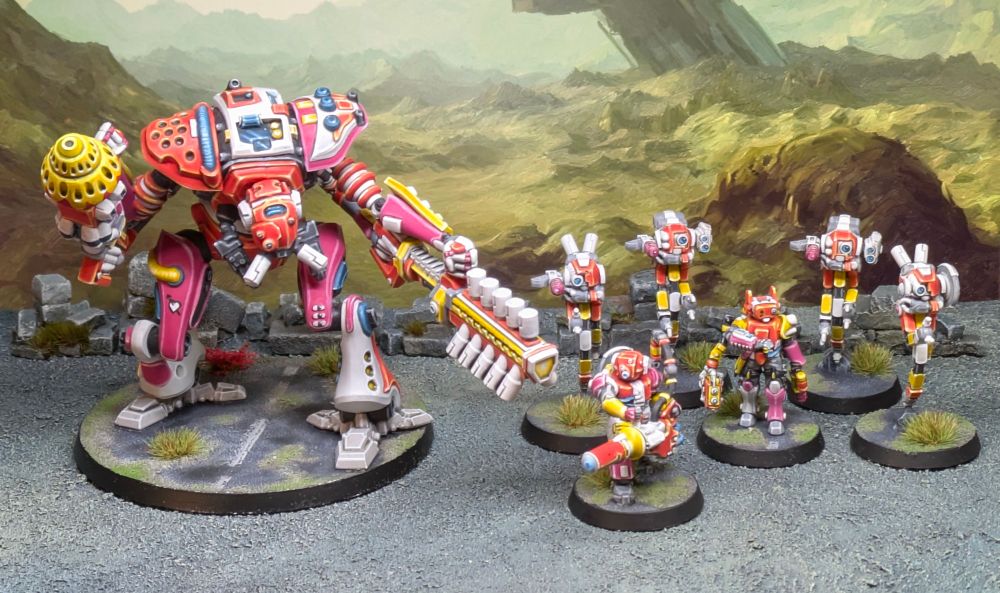 A full unit of miniatures for Zeo Genesis - a large mech, a heavy gunner chap, a drone controller and 4 drones. All painted in a riot of orange and pink and yellows