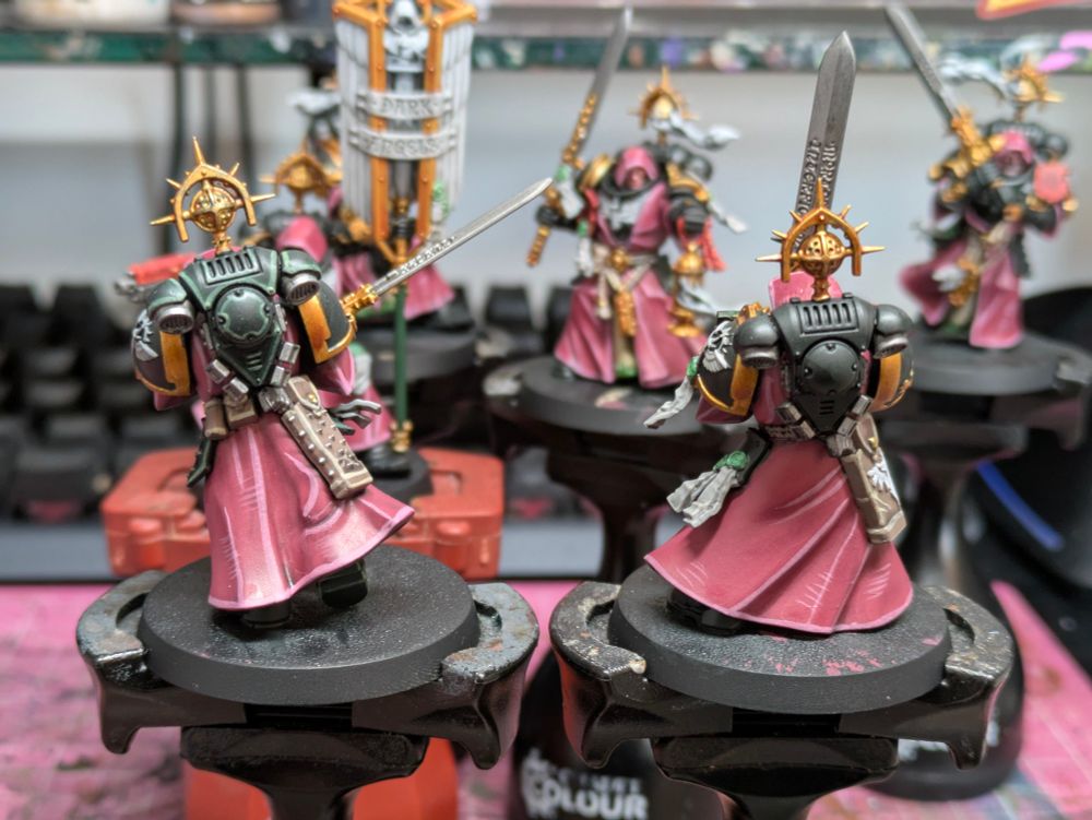 Two back views of inner circle companions miniatures for Warhammer 40 thousand