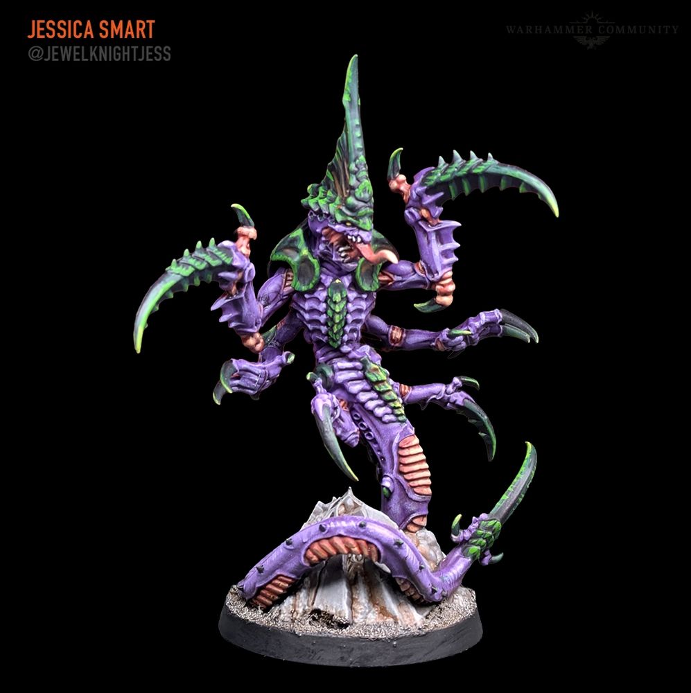 Ravener Prime Tyranid. A snake like alien creature with scything limbs, purple flesh and green carapace 