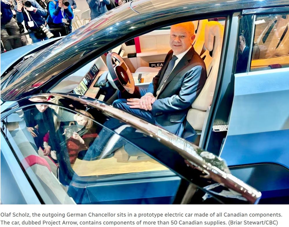 Olaf Scholz, the outgoing German Chancellor sits in a protype electric care made of all Canadian components. The car, dubbed Project Arrow, contains components of more than 50 Canadian suppliers. (Briar Stewart/CBC). From CBC News article: https://ised-isde.canada.ca/site/ised/en/hannover-messe