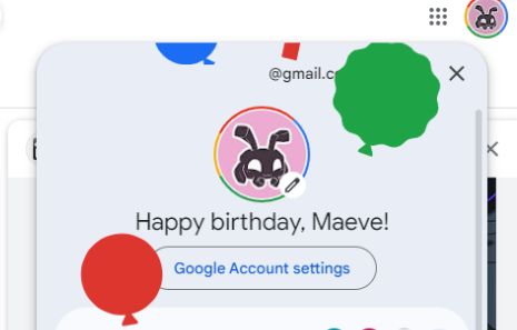screenshot of the google account picker ui, it shows my profile picture, which is my avatar on the pick background, framed in a border of four colours of google's brand, shown as an effect of an active google one subscription, then "Happy birthday, Maeve!" under it, with balloons and confetti of red, blue, green and yellow, flying around