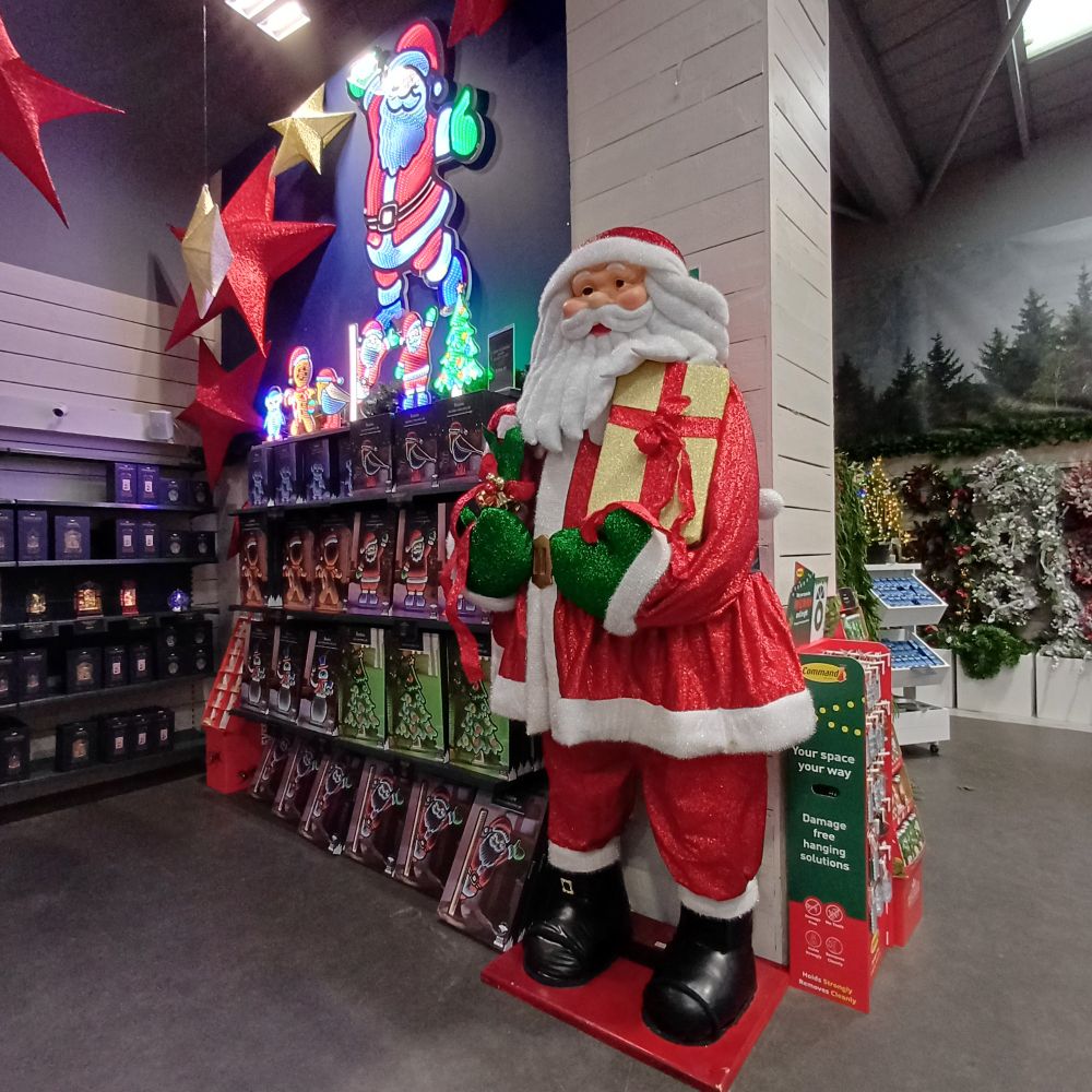 Side view showing light up and statue Santas