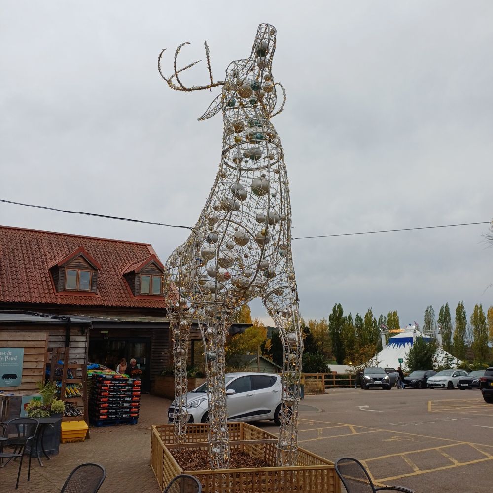 Big reindeer sculpture in a car park