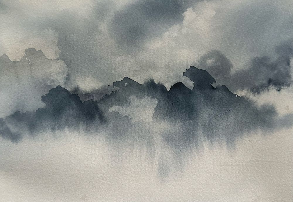 Watercolor: A cloudy skyscape in shades of blue and grey