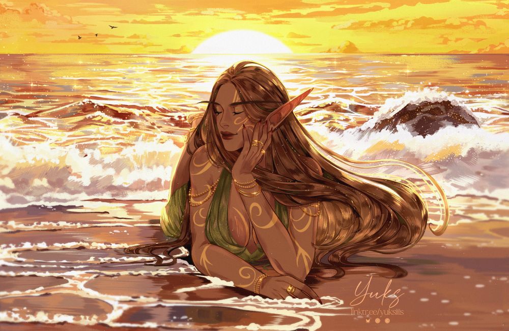 Girl lies on the seashore at sunset