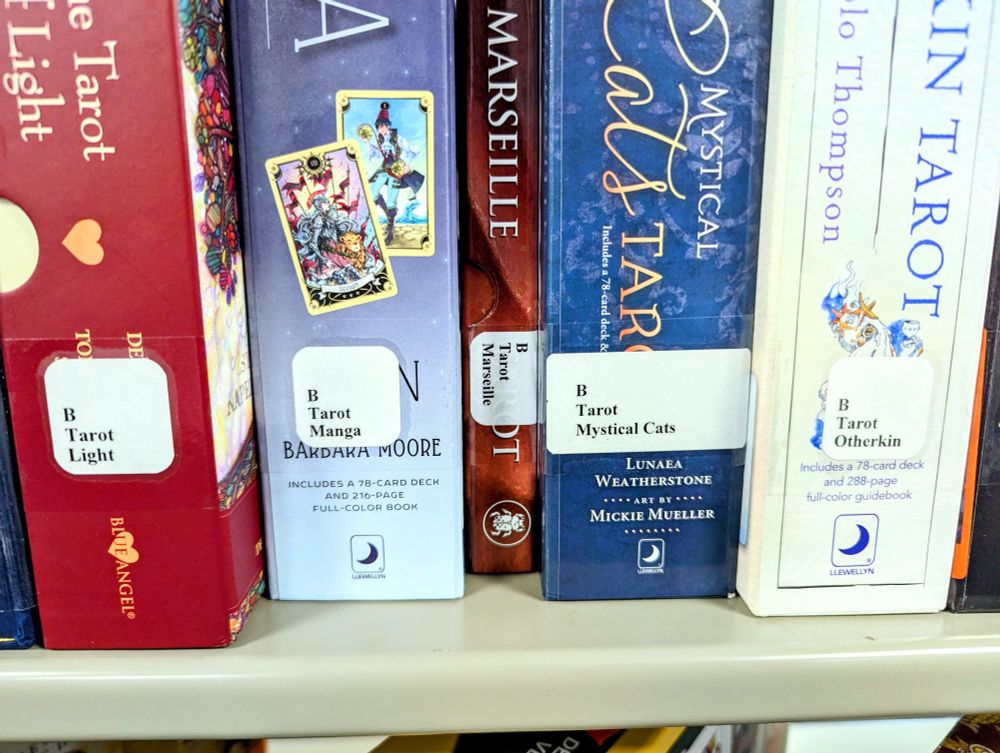 Tarot card decks on a shelf at an academic library