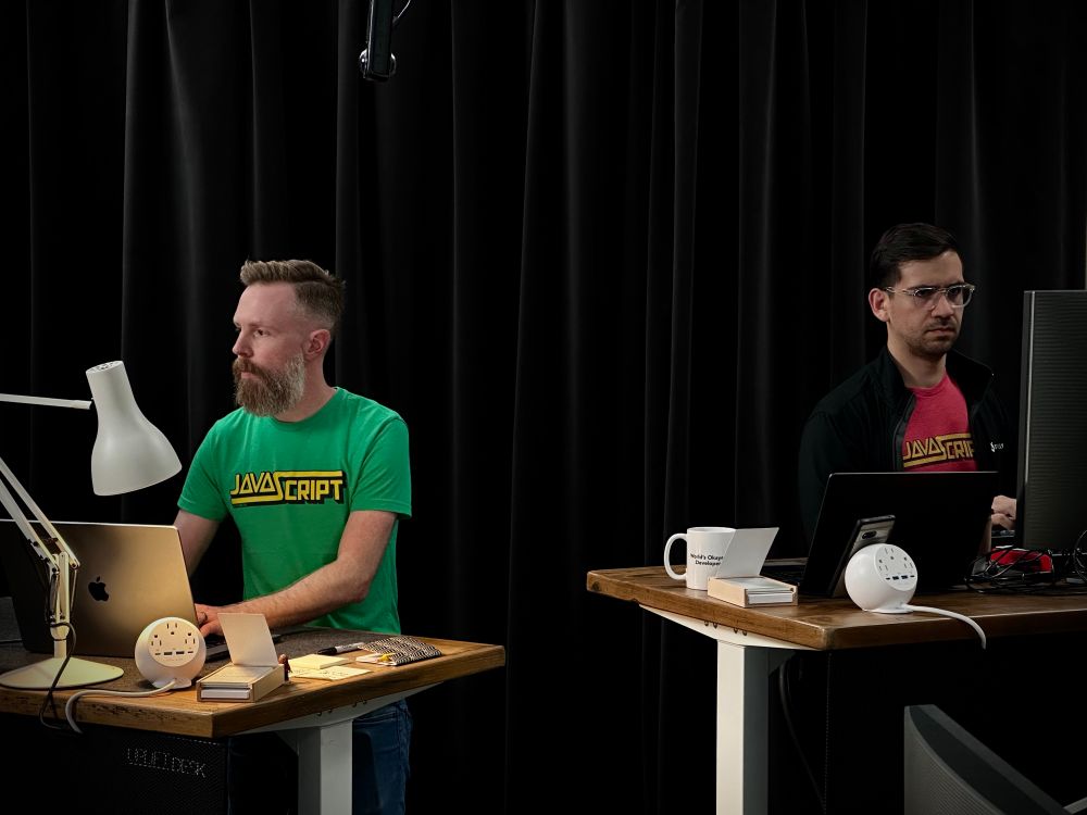 Stephen and David of the Keyframers working at desks in CodeTV Studio