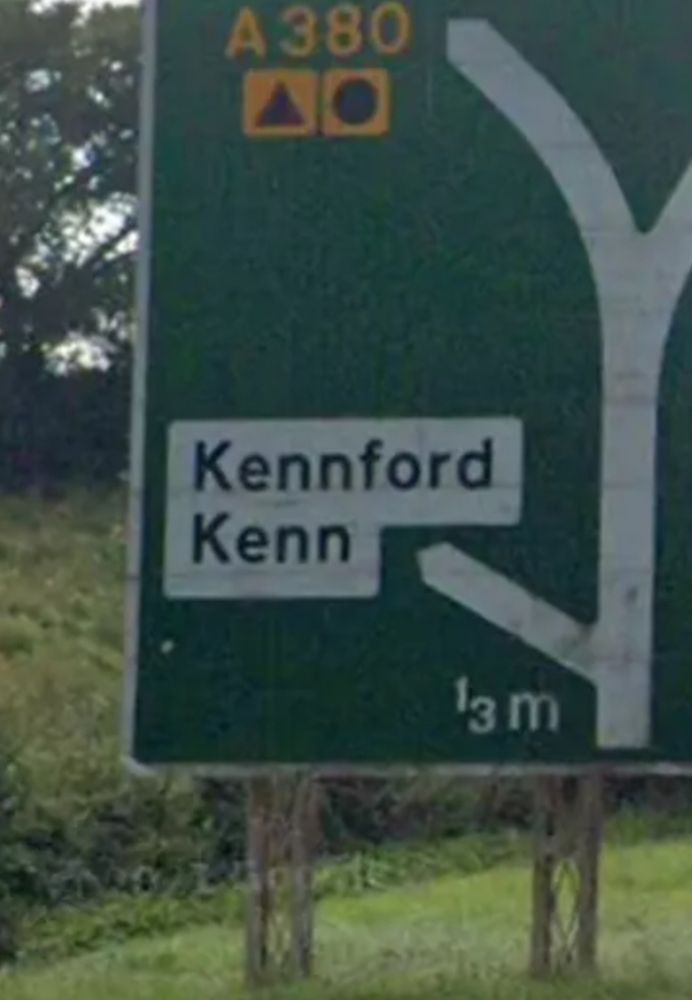 Road sign with Kennford Kenn on it 