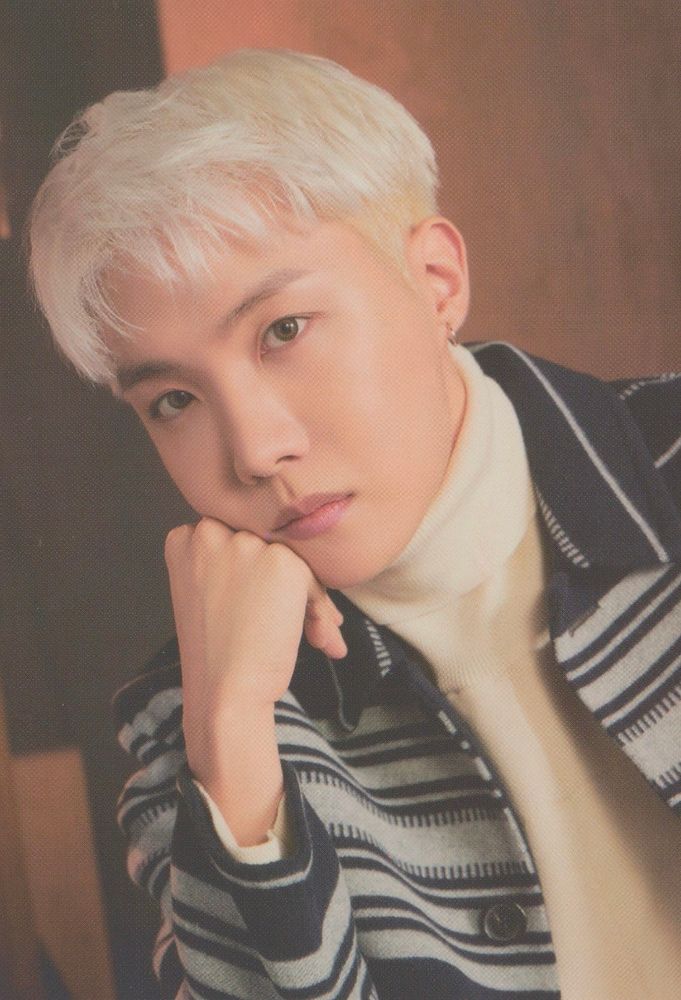 Blonde Hobi in a black and white striped sweater 