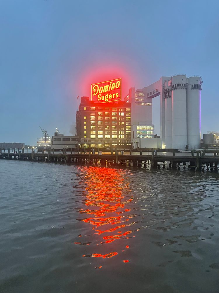 Domino Sugar plant, reflected in the water. 